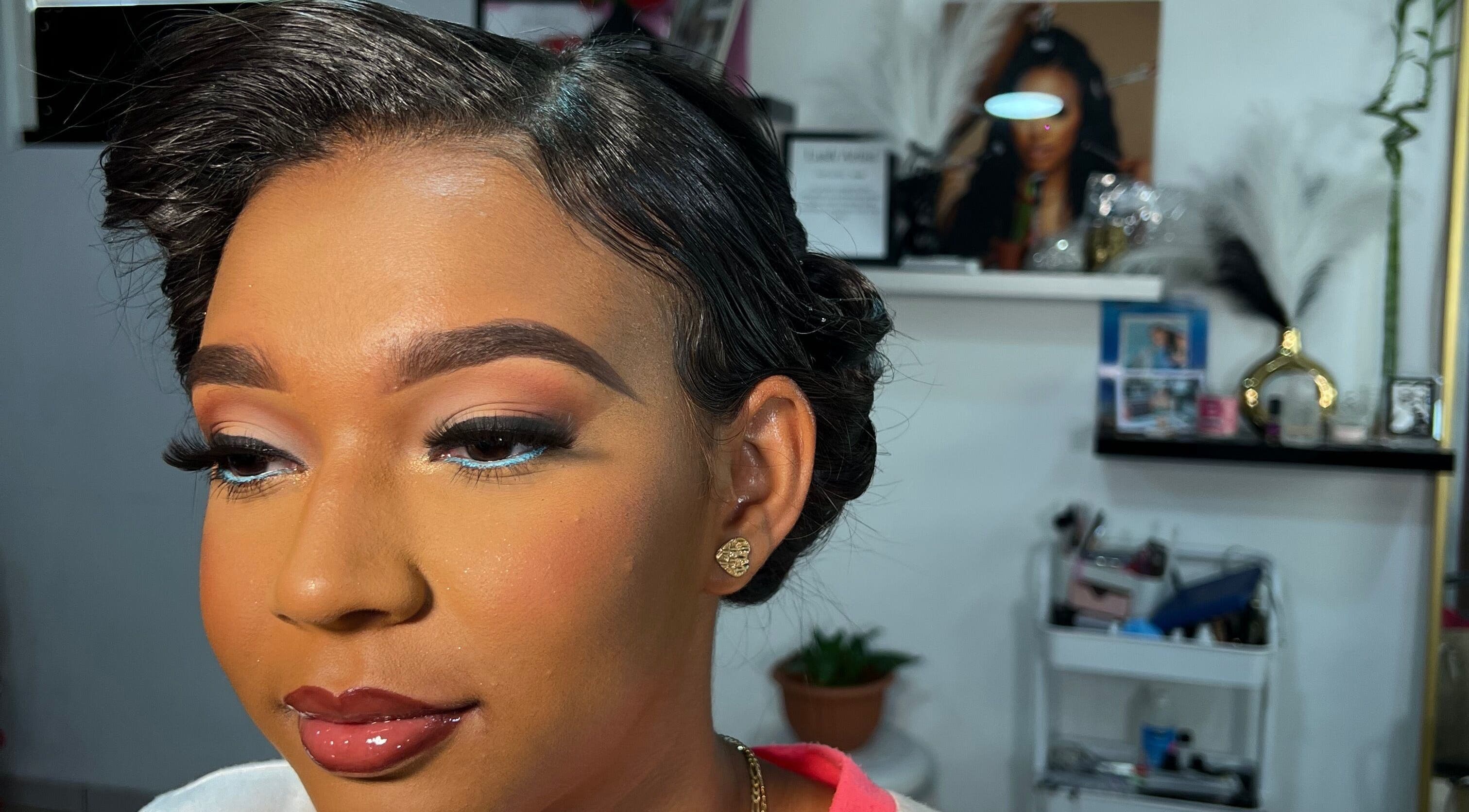 Elegant makeup at Poised Beauty in Sint Maarten, SX showcasing flawless eyebrows and shimmering lips.