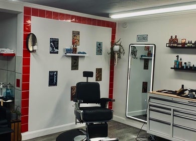 Interior of Barbershop Clandestin, Québec, Québec, CA featuring a stylish chair with grooming tools.
