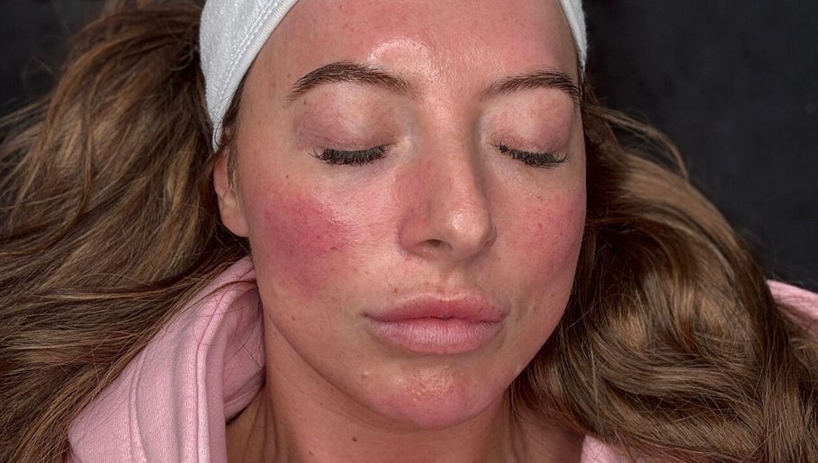 Client enjoying skincare session at Skin By Charlie, Sunderland, England, GB. Glowing skin with relaxation.