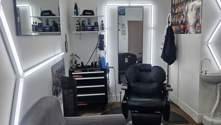 Chic interior of The Executive Barber - Moe Gaines in Phoenix, Arizona, US, featuring a sleek chair and stylish decor.
