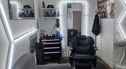 Chic interior of The Executive Barber - Moe Gaines in Phoenix, Arizona, US, featuring a sleek chair and stylish decor.