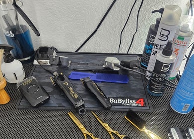 Professional barber tools on a counter at The Executive Barber - Moe Gaines, Phoenix, Arizona, US.