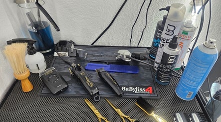 Professional barber tools on a counter at The Executive Barber - Moe Gaines, Phoenix, Arizona, US.