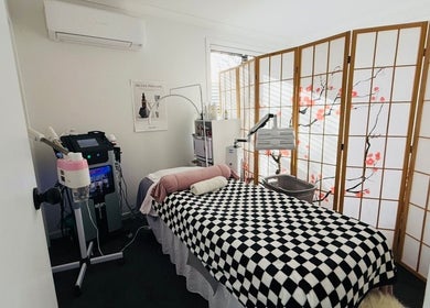 Relaxing spa room at Fusion skin beauty west Auckland, featuring a comfy bed, elegant decor, in Auckland, Auckland, NZ.