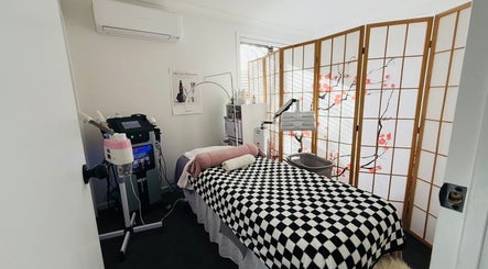 Relaxing spa room at Fusion skin beauty west Auckland, featuring a comfy bed, elegant decor, in Auckland, Auckland, NZ.