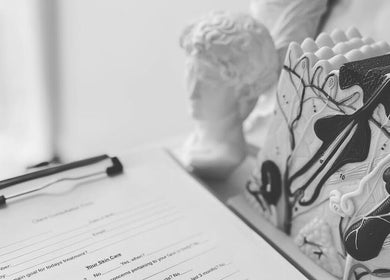 Client consultation form at Fusion Skin Beauty in West Auckland, showcasing artistic decor in Auckland, NZ.