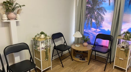 Inviting seating area at Oral Health & Beauty Spa, Canning Vale, Western Australia with tropical window decor.