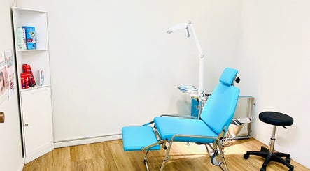 Relaxation room at Oral Health & Beauty Spa, Canning Vale, Western Australia, featuring a comfortable blue chair.