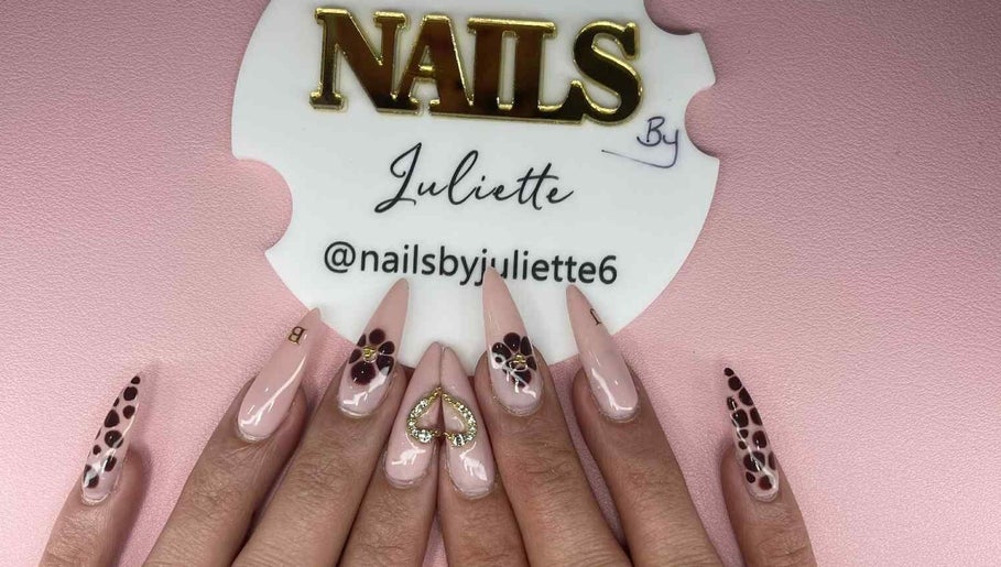 Chic nail art at Nails by Juliette in Melbourne, Victoria, AU featuring intricate designs on a pastel pink base.