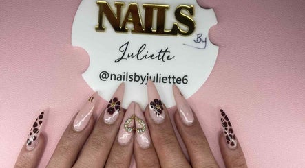 Chic nail art at Nails by Juliette in Melbourne, Victoria, AU featuring intricate designs on a pastel pink base.