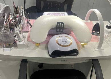 Nail station setup at Nails by Juliette, Melbourne, Victoria, AU, featuring tools and UV lamp.