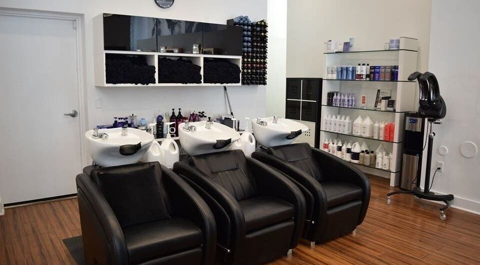 Sleek salon wash stations at Lily Of New York in Boca Raton, Florida, US, showcasing modern beauty elegance.