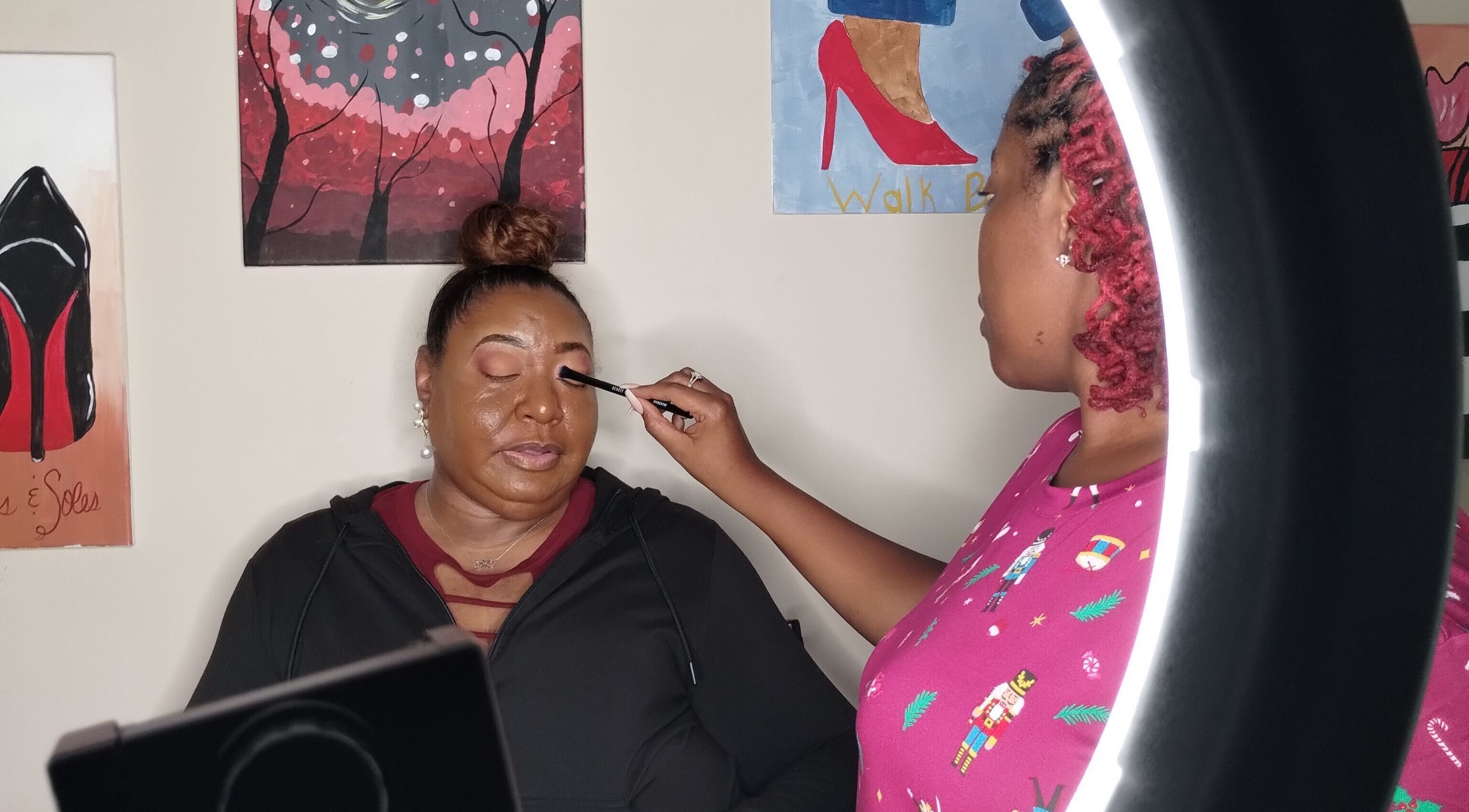 Makeup artist at Unapologetically R. Nicole | Luxe Makeup in Fultondale, Alabama, applying makeup on a client.