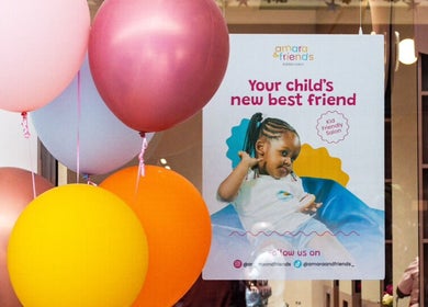 Bright balloons and a welcoming poster at Amara and Friends kiddies Salon Sandton, Gauteng, ZA.