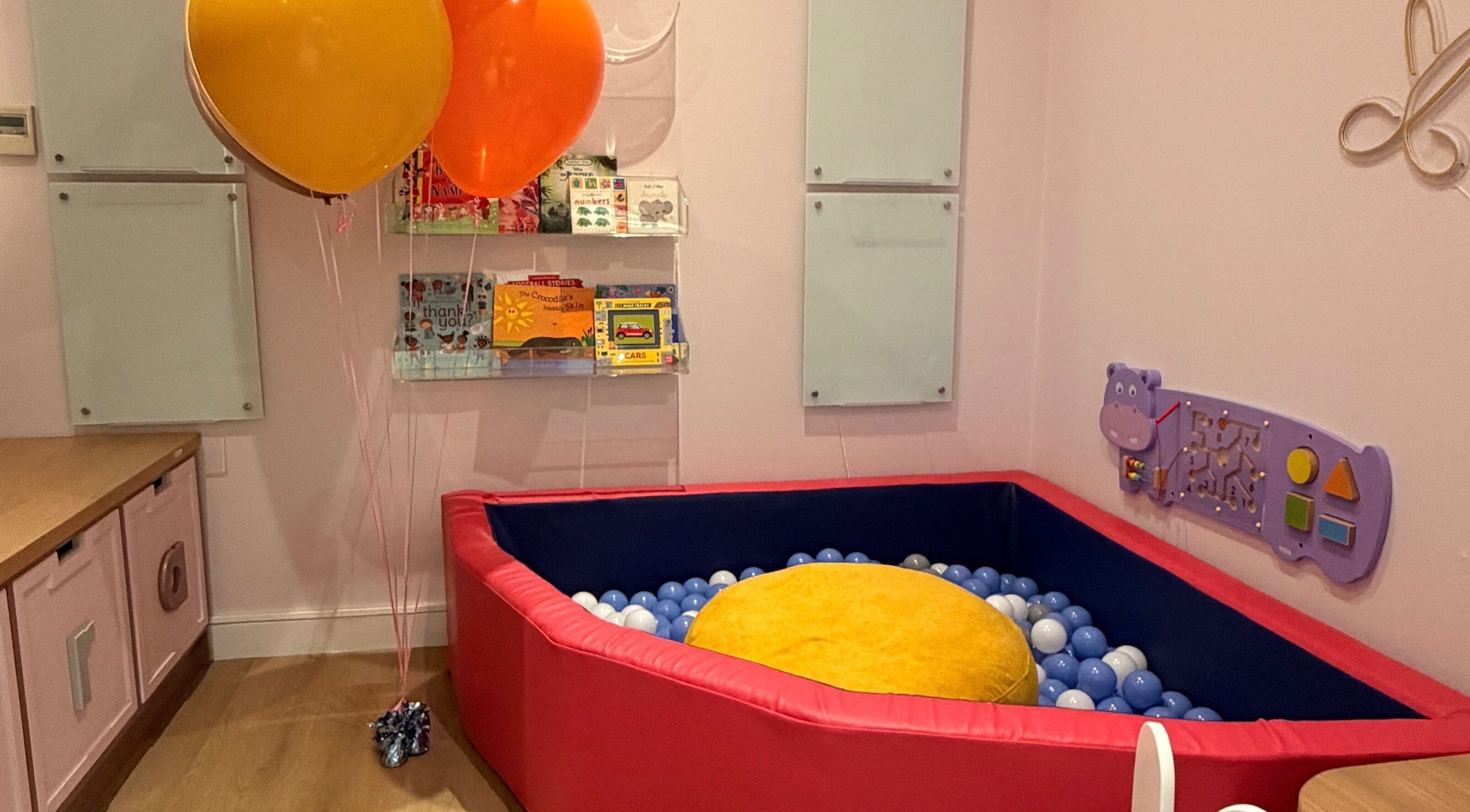 Kids' play area with colorful balloons at Amara And Friends Kiddies Salon, Sandton, Gauteng, ZA.