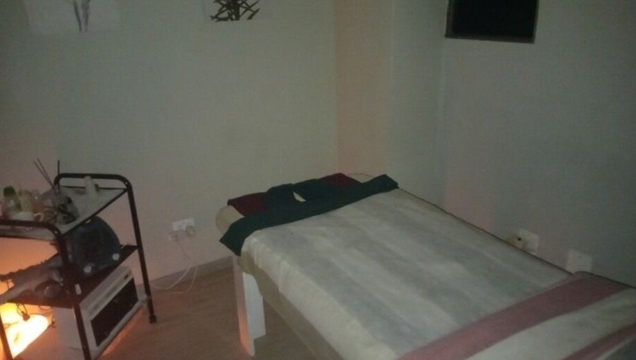 Cozy massage room at Rays Massage, Cape Town, Western Cape, ZA, with a tranquil bed setup for relaxation.