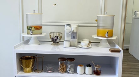 Refreshment station at Elite Spa and Beauty in Cape Town, Western Cape, ZA with infused water and coffee options.