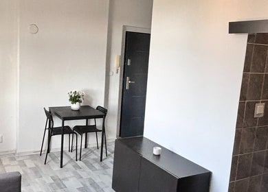 Small table and chairs in cozy setting at Blinkz, Hlavní Město Praha, Hlavní Město Praha, CZ.