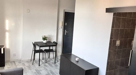 Small table and chairs in cozy setting at Blinkz, Hlavní Město Praha, Hlavní Město Praha, CZ.