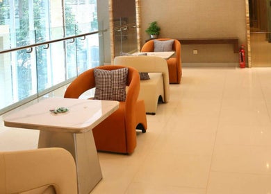 Stylish lounge area at HMD Beauty Center, Kuala Lumpur, MY. Features modern seating and ambient lighting.