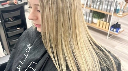Blonde hair styling at Lumi Hair Lounge, Melbourne, Victoria, AU, showcases smooth and sleek finish.