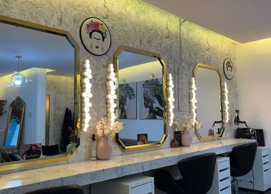 Elegant vanity mirrors with lighting at Moon Spa, Dammam, Eastern Province, SA. Chic and modern ambiance.