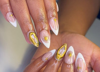 Elegantly manicured nails with gold star design at CLAWS BY KRIS, Cape Town, Western Cape, ZA.