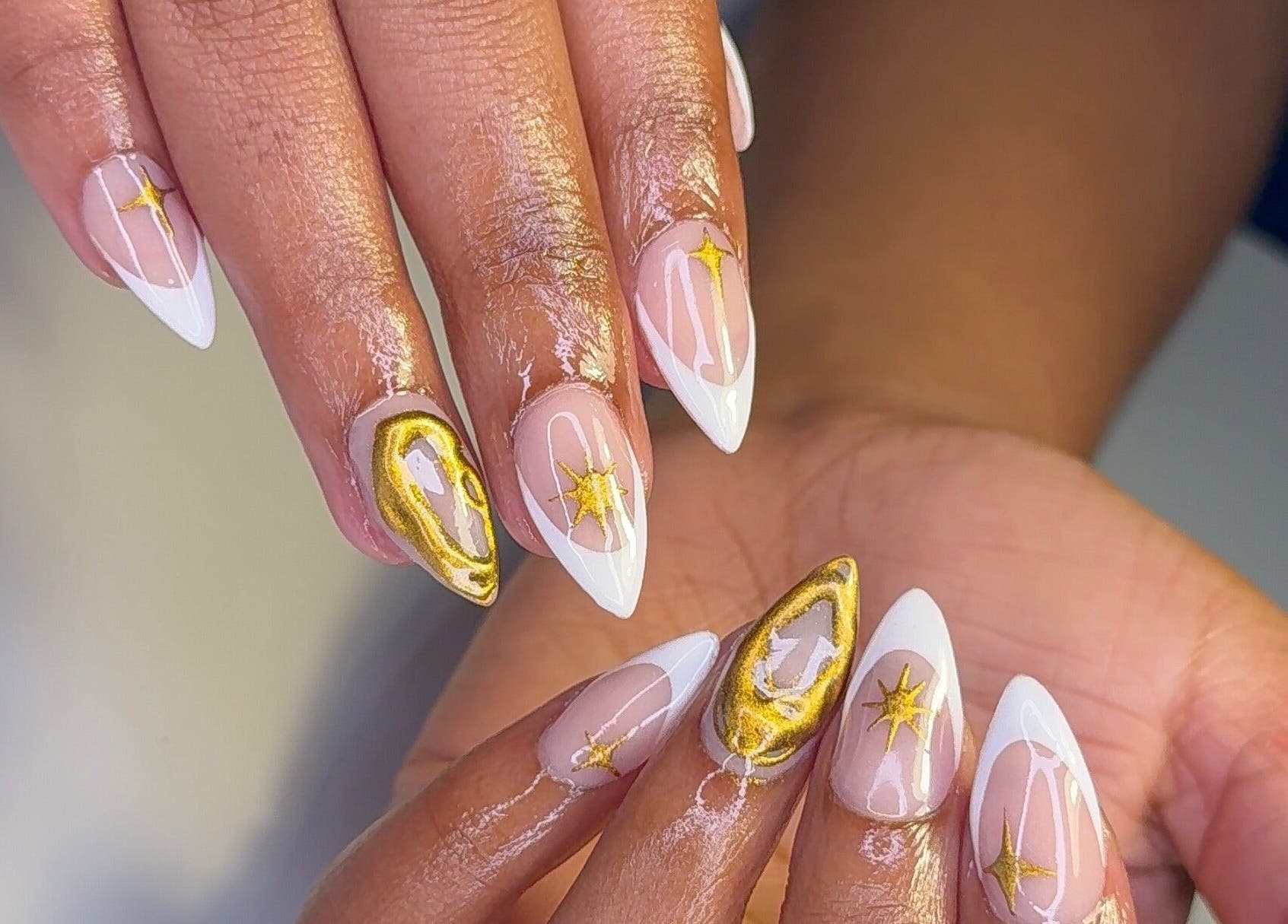 Elegantly manicured nails with gold star design at CLAWS BY KRIS, Cape Town, Western Cape, ZA.
