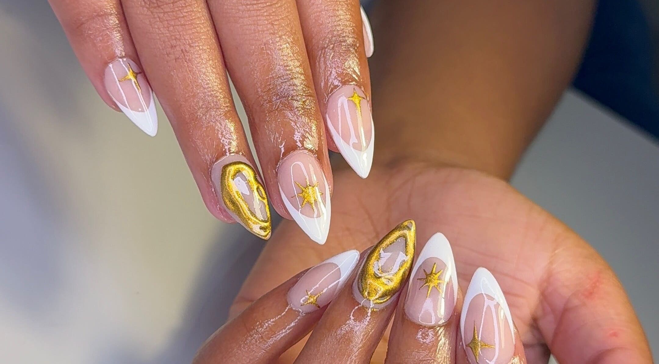 Elegantly manicured nails with gold star design at CLAWS BY KRIS, Cape Town, Western Cape, ZA.