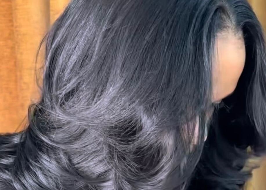 Elegant black hair styled at CLAWS BY KRIS, Cape Town, Western Cape, ZA for a polished look.