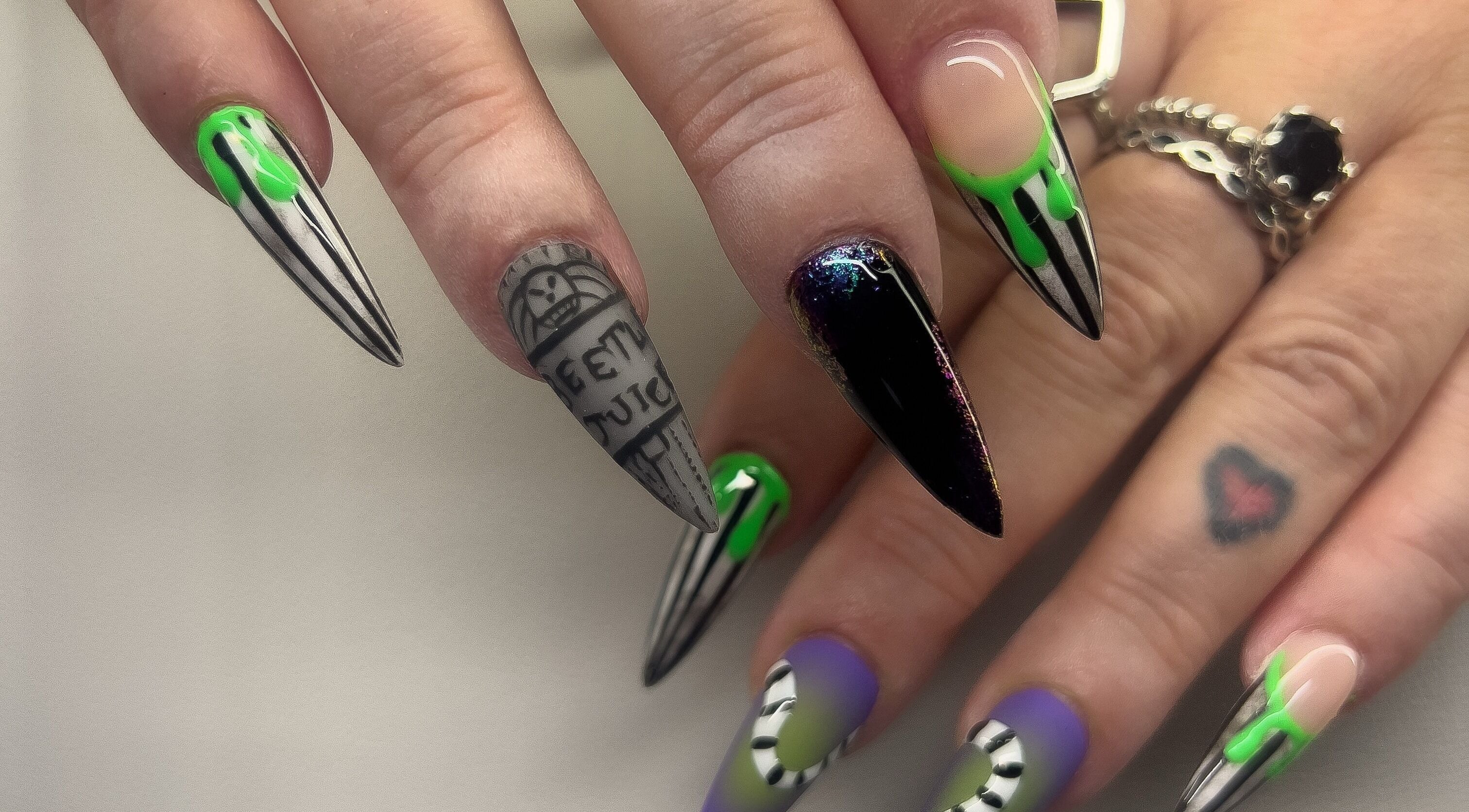 Unique nail designs at Noir, The Nail Bar in Cleethorpes, England, GB showcasing intricate, colorful patterns.