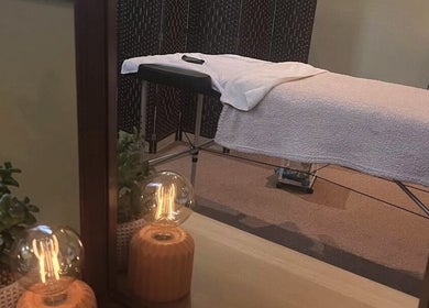 Calming therapy room at Dragonfly Counselling & Reiki in Hebburn, England, GB with table and soft lighting.