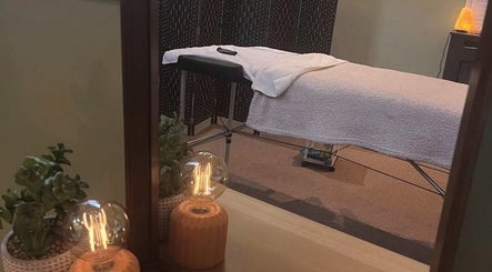 Calming therapy room at Dragonfly Counselling & Reiki in Hebburn, England, GB with table and soft lighting.