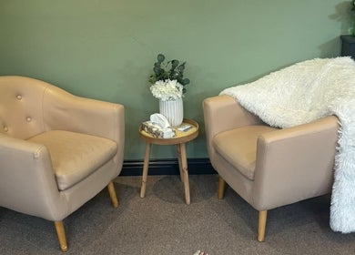 Comfortable seating area at Dragonfly Counselling & Reiki, Hebburn, England. Features soft chairs and decor.