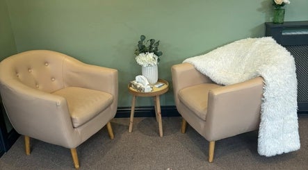 Comfortable seating area at Dragonfly Counselling & Reiki, Hebburn, England. Features soft chairs and decor.