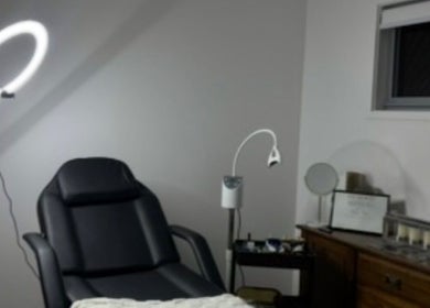 Relaxing spa treatment room at Soulbi Studio, Primbee, New South Wales, AU with massage chair and soft lighting.