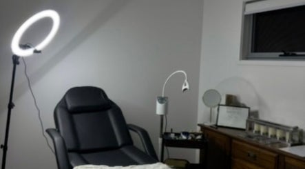 Relaxing spa treatment room at Soulbi Studio, Primbee, New South Wales, AU with massage chair and soft lighting.