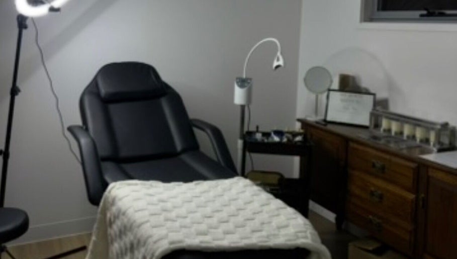Cozy treatment room at Soulbi studio, Primbee, New South Wales, AU, featuring a comfortable recliner and soft lighting.