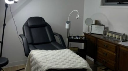 Cozy treatment room at Soulbi studio, Primbee, New South Wales, AU, featuring a comfortable recliner and soft lighting.