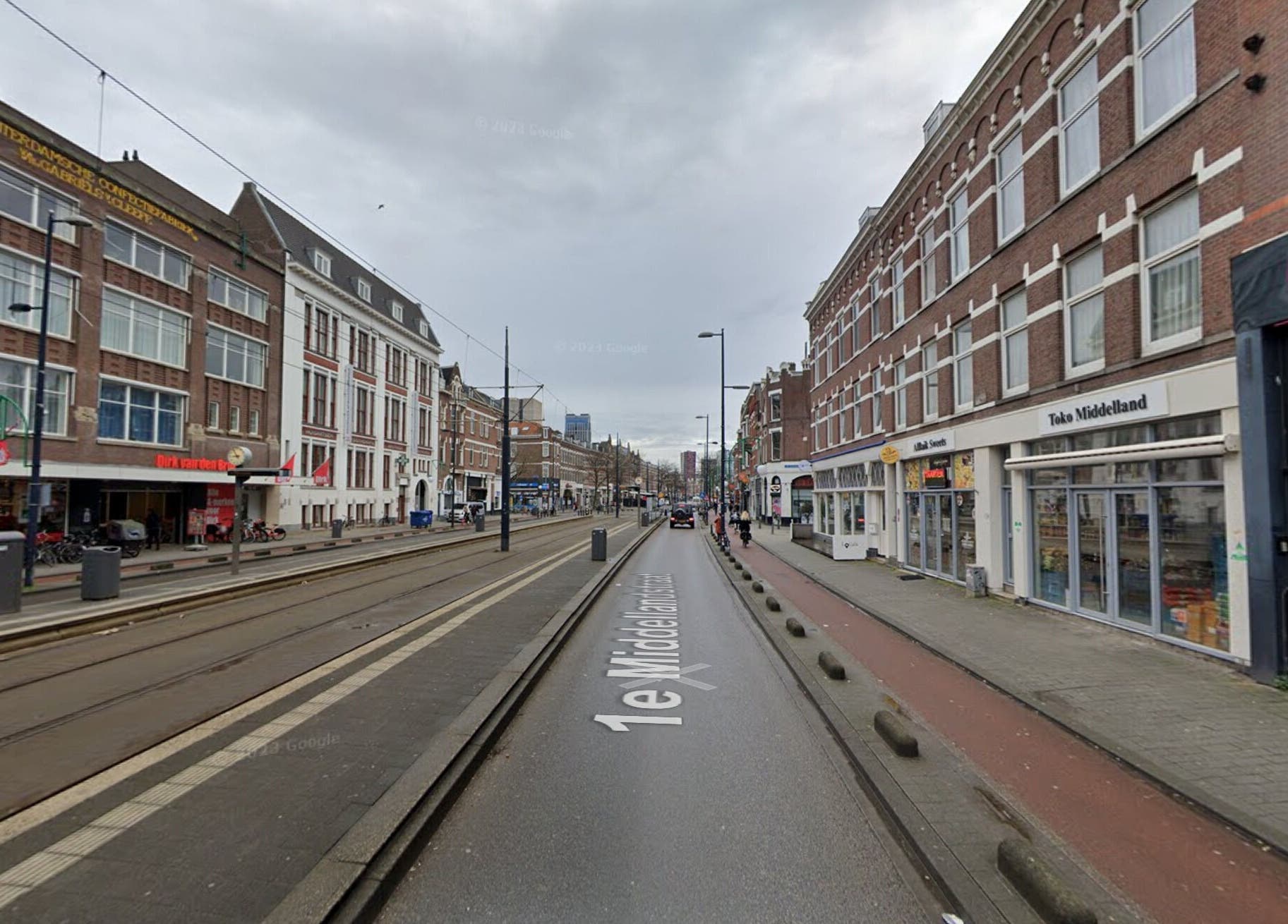 Street view near CarlosKapperRotterdamWest, Rotterdam, Zuid-holland, NL reflecting vibrant local architecture.