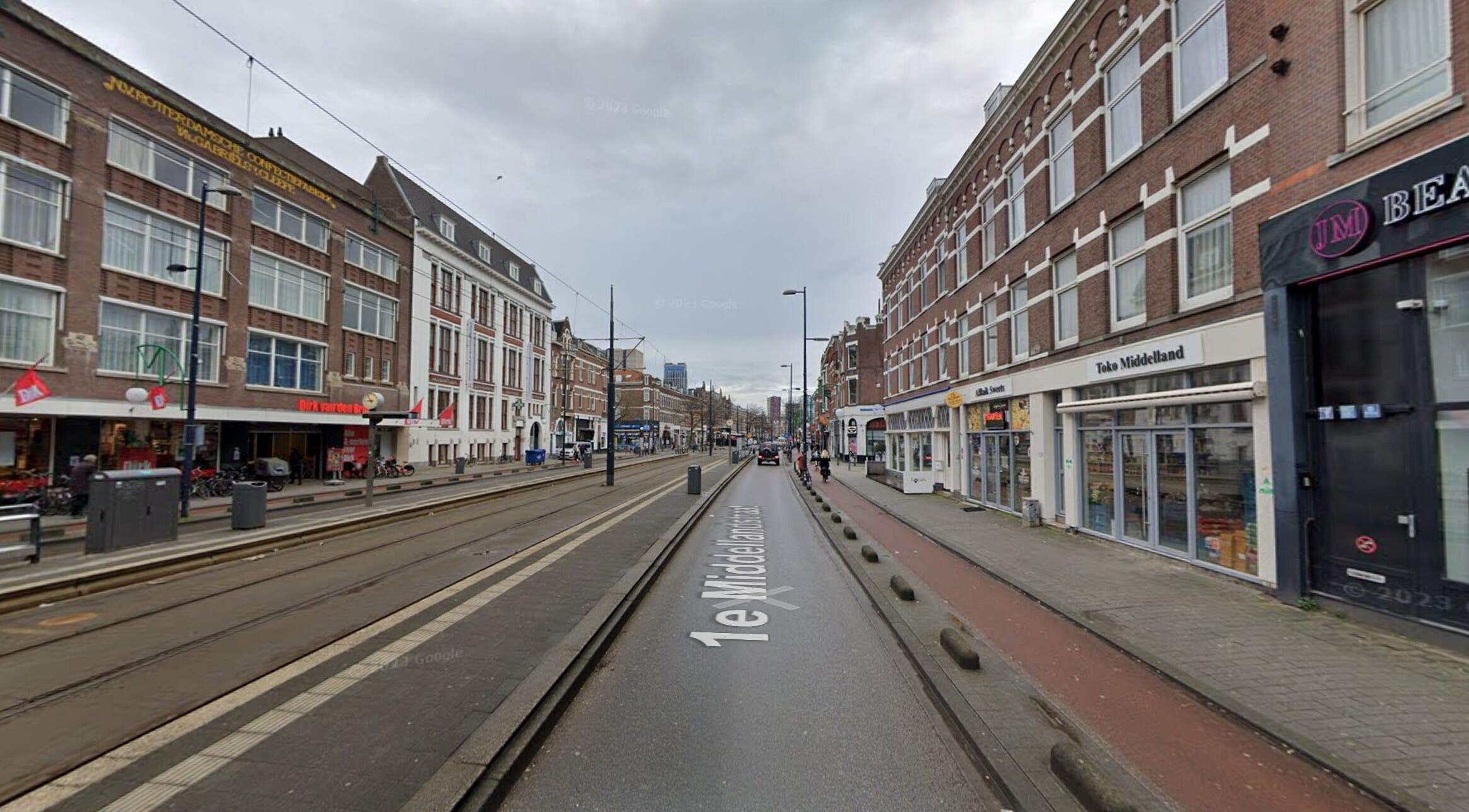 Street view near CarlosKapperRotterdamWest, Rotterdam, Zuid-holland, NL reflecting vibrant local architecture.