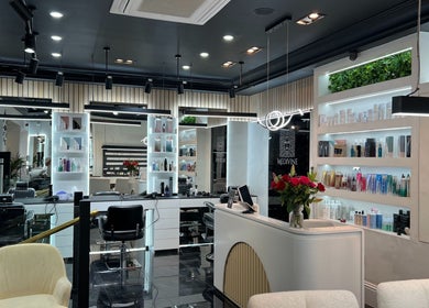 Elegant interior of Medivine salon in Birmingham, England, GB showcasing modern decor and beauty products.