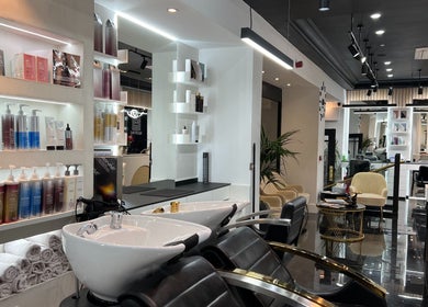 Modern beauty salon interior at Medivine, Birmingham, England, GB showcasing sleek design and professional products.