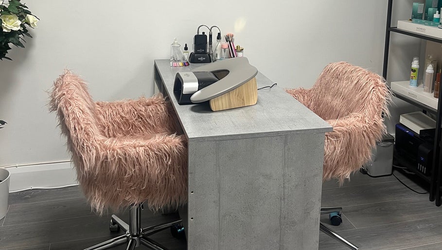 Cozy nail station with pink fluffy chairs at The Nail Nest by Shannen, Limerick, County Limerick, IE.