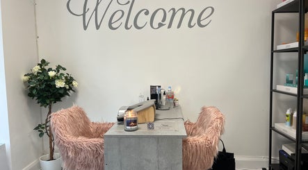 Welcoming nail salon desk at The Nail Nest by Shannen, Limerick, County Limerick, IE with plush seating.