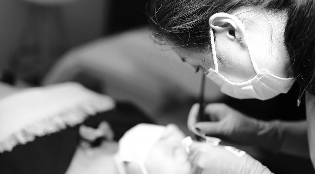 Aesthetic technician perfecting beauty treatment at Thy Beauty Studio, Solihull, England, GB.