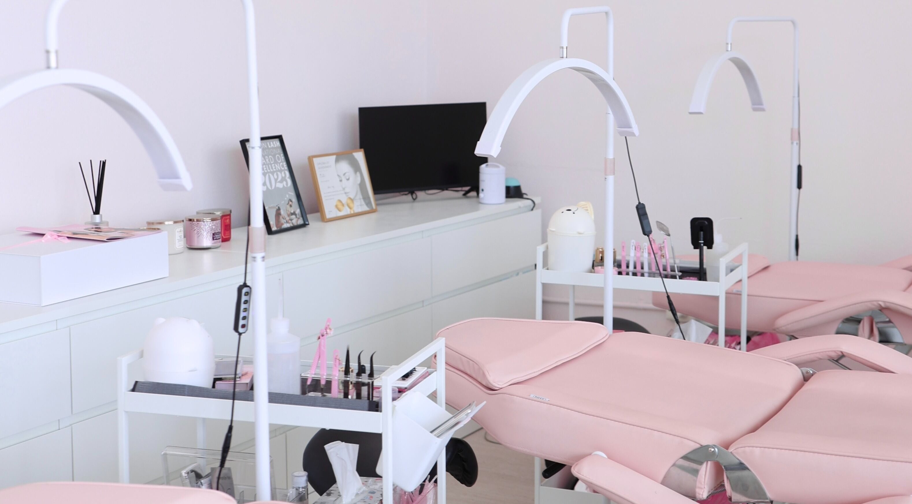 Modern beauty treatment room at Glo Artistry, Narwee, New South Wales, AU, featuring pink aesthetic and equipment.