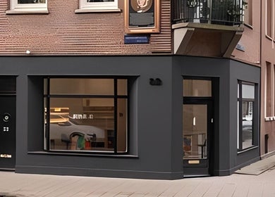 Exterior of Artist Lab in Amsterdam, Noord-Holland, NL features a sleek black facade and large display windows.