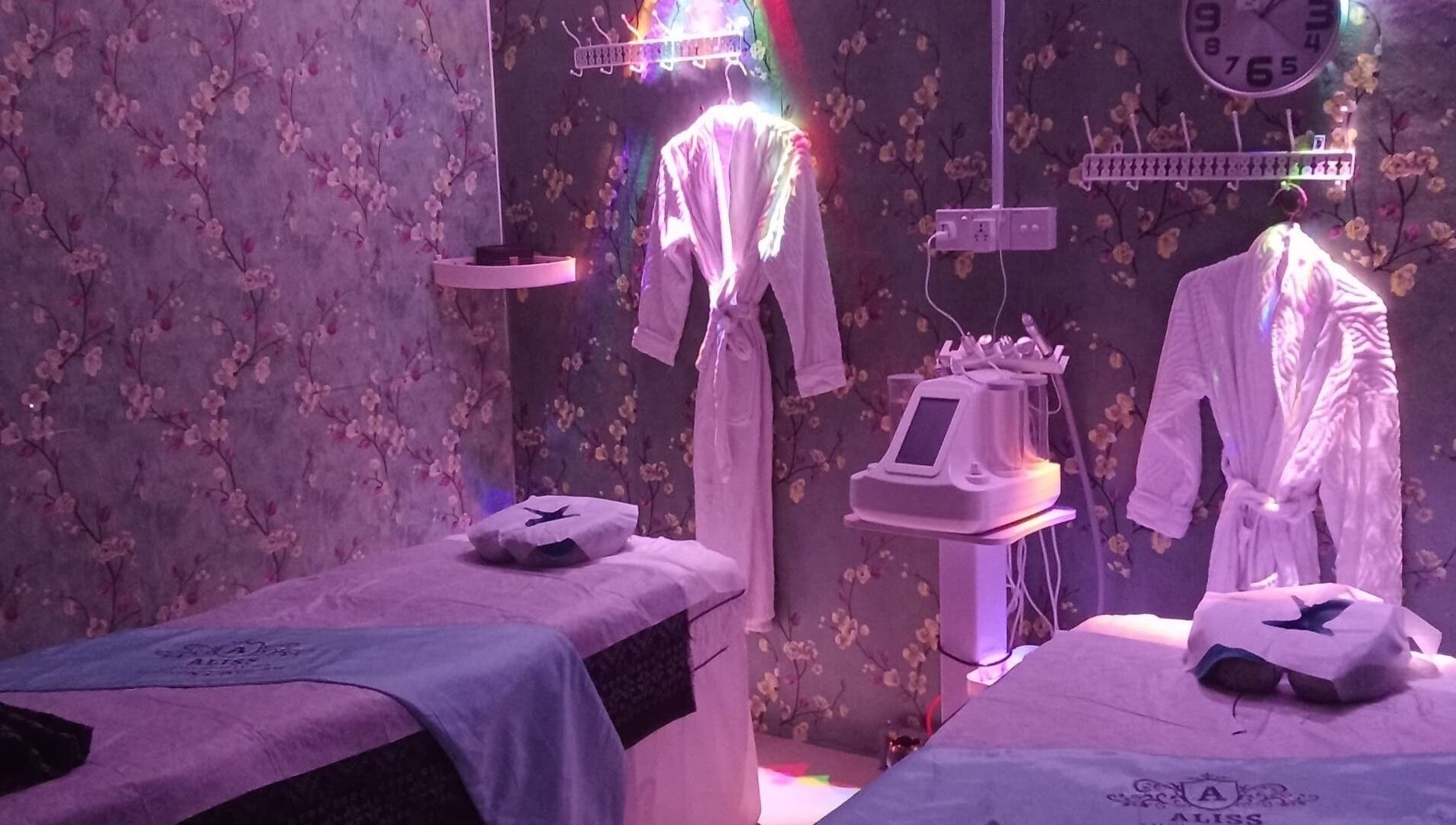 Calming spa room at Aliss Salon Beauty Spa, Kuah, Kedah, MY with cozy robes and treatment beds.