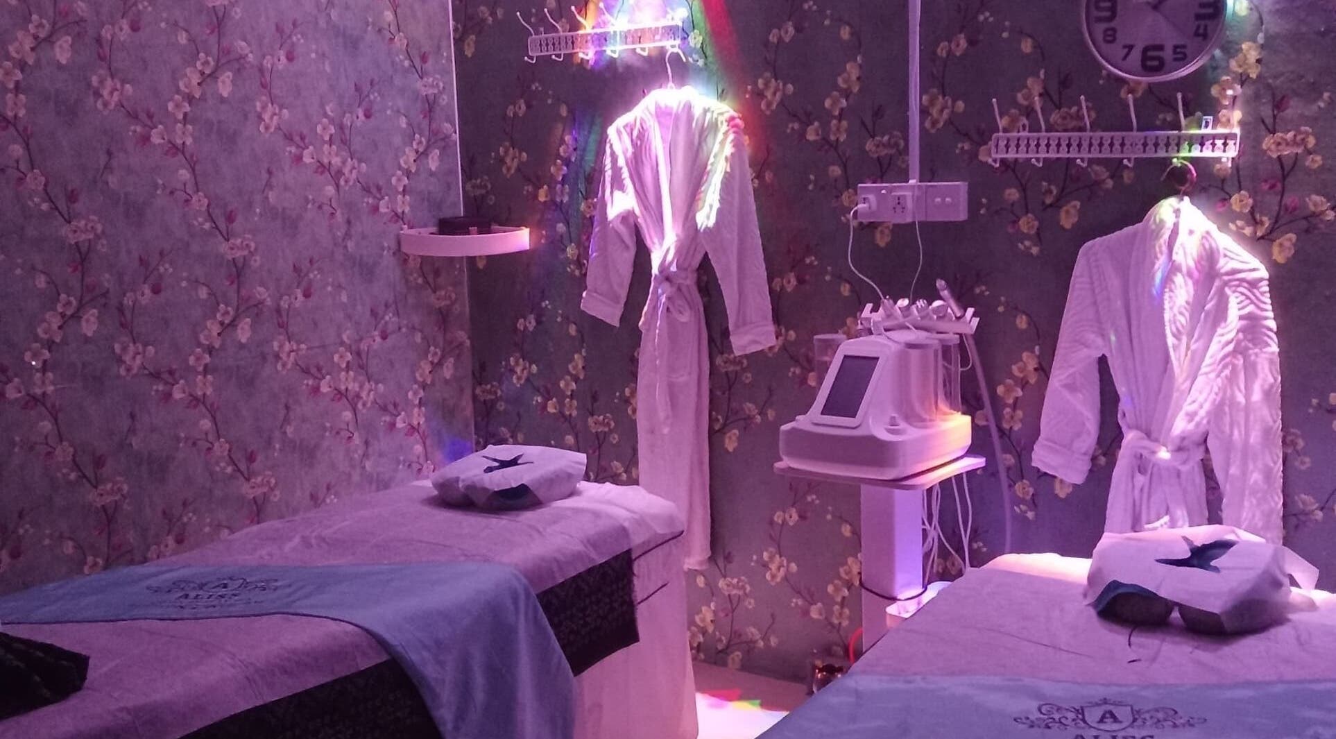 Calming spa room at Aliss Salon Beauty Spa, Kuah, Kedah, MY with cozy robes and treatment beds.